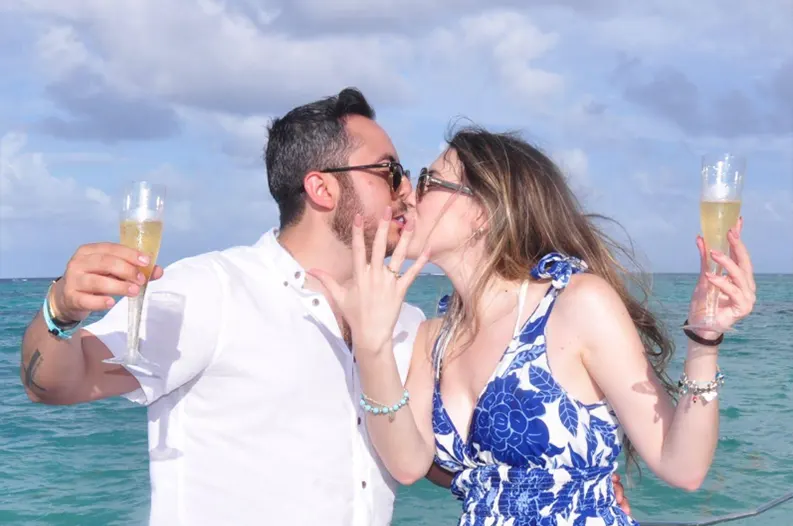 Couple celebrating on a yacht charter